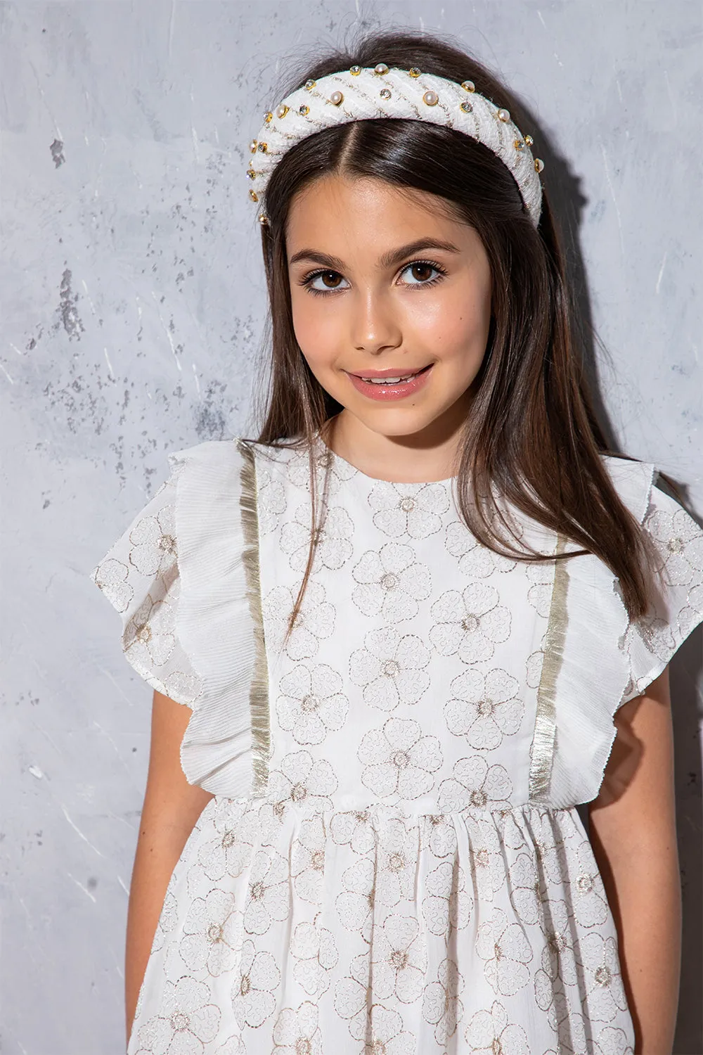 White and gold floral dress with metal fringes and frilled sleeves